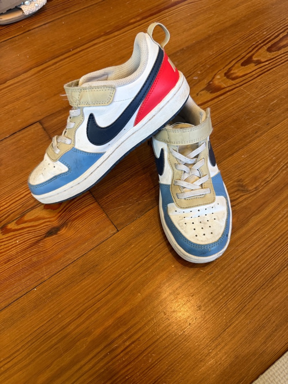 Kids Navy & Blue Nike Athletic Sneakers with Red Accent